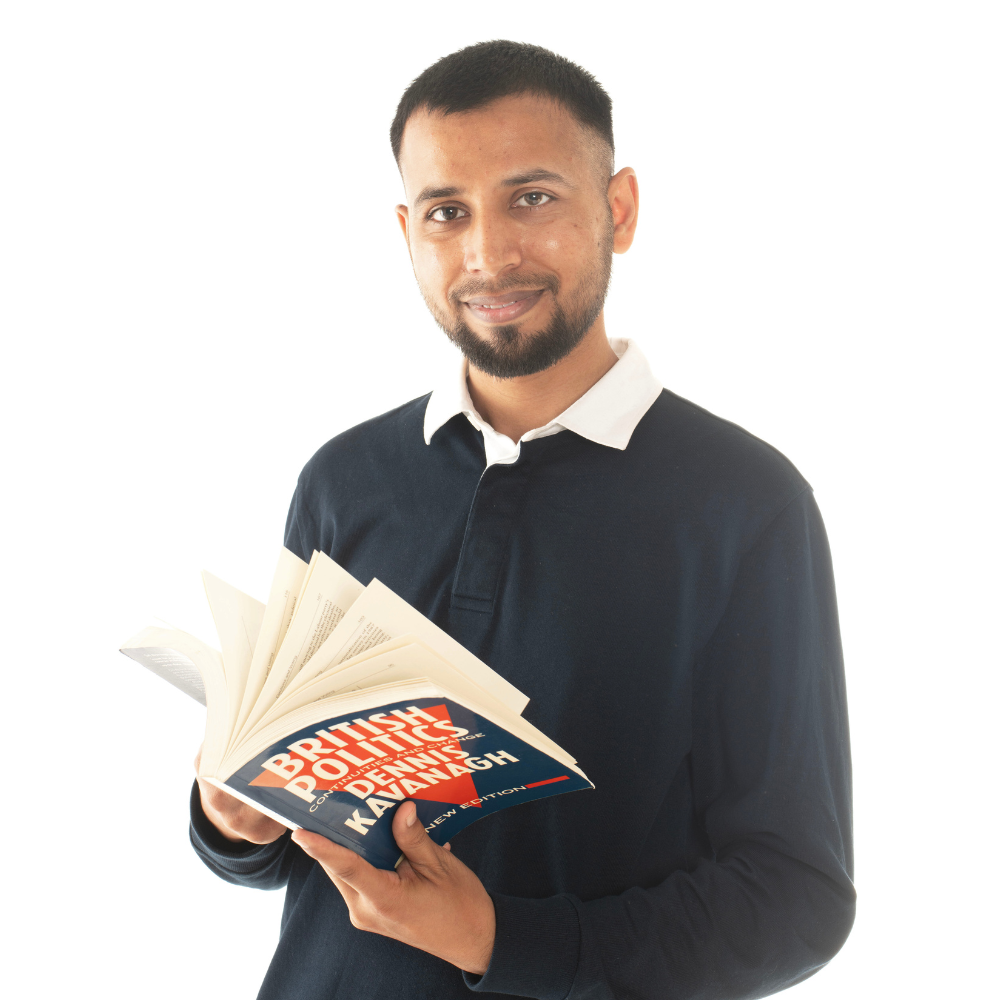 Faran Sabir, flicking through a book on British politics.